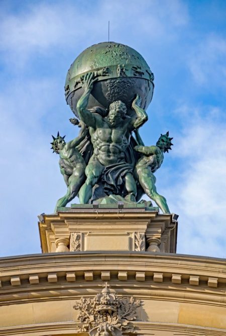 Thie Tricky Riddle is about Atlas, an ancient Greek Titan. This picture is of a Statue of Atlas the Titan, holding up the world.