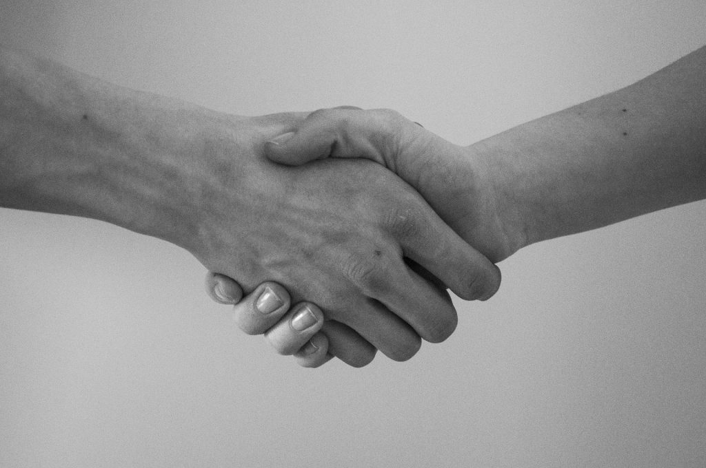 Our Terms of Service is a friendly agreement between us, intended to keep both our interests safe. This picture is of us shaking hands.