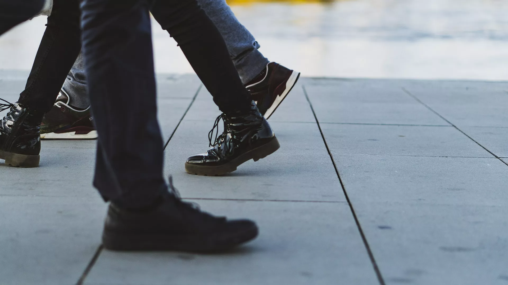 This Conundrum is about shoes and boots! The picture is of foot traffic that, showing people's shoed feet!